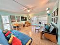 Spacious living area with comfortable seating and access to balcony at 2850 Gulf Of Mexico Dr # 2, Longboat Key, FL 34228