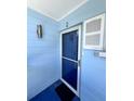 Front door of a condo unit with screen door at 2850 Gulf Of Mexico Dr # 2, Longboat Key, FL 34228