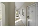 Shared hallway with light walls and tiled floors at 408 Cerromar S Cir # 130, Venice, FL 34293