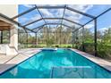 Gorgeous screened-in pool and spa boasts ample space for relaxing and entertaining outdoors at 1111 143Rd Ne St, Bradenton, FL 34212