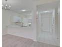 Modern kitchen with white cabinets, quartz countertops, and breakfast bar at 4210 Caddie E Dr # 102, Bradenton, FL 34203