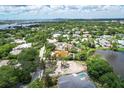 Aerial view showcasing a neighborhood near the water at 4431 Camino Real, Sarasota, FL 34231