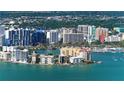 Aerial view of waterfront property with upscale high-rise buildings and marina at 1233 N Gulfstream Ave # 1001, Sarasota, FL 34236
