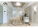 Elegant lobby with seating area and elevators at 393 N Point Rd # 801, Osprey, FL 34229