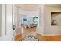 Bright entryway with hardwood floors and view of living room at 393 N Point Rd # 801, Osprey, FL 34229