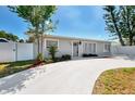 Delightful single-story home with a charming entrance, and a circular driveway leading up to it at 1012 Myrtle Ave, Venice, FL 34285