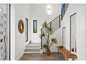 Modern entryway with a contemporary staircase and stylish decor at 577 Venice Ln, Sarasota, FL 34242