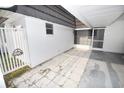 Small patio adjacent to the villa, ideal for relaxing at 3961 Ashwood Ln # 44, Sarasota, FL 34232