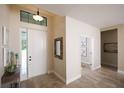 Bright and airy entryway with tile flooring and decorative accents at 2471 W Price Blvd, North Port, FL 34286