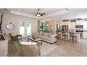 Open living space featuring a comfortable sofa and access to the backyard at 2471 W Price Blvd, North Port, FL 34286