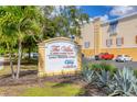 The Villas at Osprey Harbor Village, featuring a lush, tropical entrance and marina and dry rack storage at 14041 Bellagio Way # 214, Osprey, FL 34229