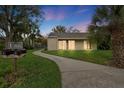 Inviting home exterior with walkway at dusk at 2212 Bahia Vista St # I1, Sarasota, FL 34239