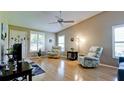 Living room with hardwood floors, fireplace, and comfy seating at 2911 74Th W St # 2276, Bradenton, FL 34209
