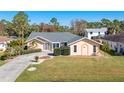 Single-story home with a driveway and landscaped yard at 2837 Cabaret St, Port Charlotte, FL 33948