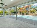 Screened-in pool and patio area with concrete flooring at 2837 Cabaret St, Port Charlotte, FL 33948