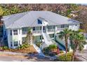 Two-story building with metal roof and balconies at 294 Hidden Bay Dr # 103, Osprey, FL 34229