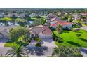 Expansive aerial shot showcasing a lovely home near a pond in a beautiful neighborhood at 2921 Seasons Blvd, Sarasota, FL 34240