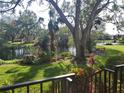 Peaceful backyard oasis with pond view and lush landscaping at 6466 Seagull Dr # 323, Bradenton, FL 34210