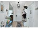 Bright and spacious entryway with bench seating and coat rack at 10630 Lure Pl, Parrish, FL 34219