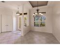 Bright dining room with tiled floors and elegant chandelier at 22575 Morning Glory Cir, Bradenton, FL 34202