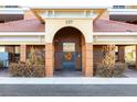 Condo building entrance with secure gate and elevator access at 157 Tampa Ave # 707, Venice, FL 34285