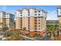 Condo building exterior showcasing architectural details and landscaping at 157 Tampa Ave # 707, Venice, FL 34285