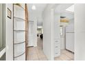 Bright entryway with built-in shelving and view to living room at 6010 Arlene Way, Bradenton, FL 34207