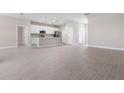 Open concept kitchen with white cabinets and modern appliances at 2775 Pecan St, North Port, FL 34287