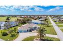 Single-Gathering home with circular driveway and golf course view at 54 Medalist Pl, Rotonda West, FL 33947