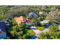 Property showcasing a tile roof, and a lush green lawn at 21 Bayhead Ln, Osprey, FL 34229