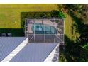 Enclosed rectangular pool in backyard at 14308 Tugwell Ave, Port Charlotte, FL 33953