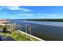 Scenic waterfront view with palm trees and waterway at 9393 Midnight Pass Rd # 503, Sarasota, FL 34242