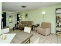 Bright living room featuring a sofa, dining table, and neutral color scheme at 6041 Lilli Way # 72, Bradenton, FL 34207