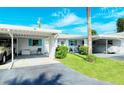 Two-unit building with carport parking and well-maintained landscaping at 6041 Lilli Way # 72, Bradenton, FL 34207