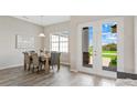 Casual dining area with patio doors and view at 27059 Curitiba Dr, Punta Gorda, FL 33983