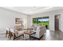 Relaxing living room with sliding doors and view at 27059 Curitiba Dr, Punta Gorda, FL 33983