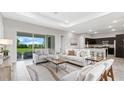 Bright living room with modern furniture and view at 27059 Curitiba Dr, Punta Gorda, FL 33983