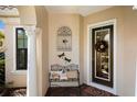 Inviting entryway with decorative wrought iron and bench at 7232 Presidio Gln, Lakewood Ranch, FL 34202