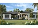 Modern home with pool and covered patio, showcasing a stunning backyard at 1802 Field Rd, Sarasota, FL 34231