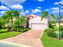 Single-Gathering home with a two-car garage and palm trees at 4139 63Rd E Ter, Sarasota, FL 34243