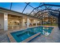 Inviting pool and spa area with covered patio at 4121 Bahia Vista St, Sarasota, FL 34232