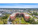 Aerial view of condo complex with surrounding landscape at 3006 Caring Way # 224, Port Charlotte, FL 33952