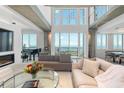 Spacious living room with high ceilings and water views at 800 N Tamiami Trl # 1603, Sarasota, FL 34236