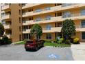 Tan multi-story building with parking and landscaping at 4550 Pinebrook Cir # 103, Bradenton, FL 34209