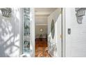 Inviting entryway with a glass door and hardwood floors at 1789 Loma Linda St, Sarasota, FL 34239