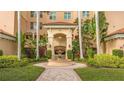 Elegant building entrance with fountain and manicured landscaping at 393 N Point Rd # 603, Osprey, FL 34229