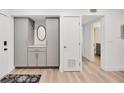 Bright entryway with built-in storage and view to the living area at 2100 Benjamin Franklin Dr # 205, Sarasota, FL 34236