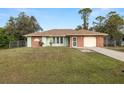 Newly painted light green ranch home with a 1 car garage at 21024 Baffin Ave, Port Charlotte, FL 33954