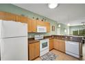 Well-equipped kitchen with light wood cabinets at 3919 Cape Haze Dr # 506, Rotonda West, FL 33947