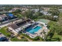 Aerial view of community pool, clubhouse, and manicured lawn area at 7201 29Th Avenue W Dr # 309, Bradenton, FL 34209